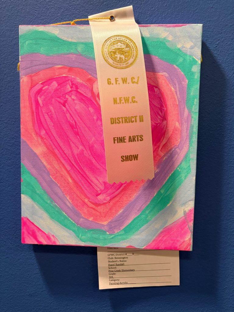 A colorful heart painting with pink, purple, and green swirls, displaying a ribbon for a fine arts show.