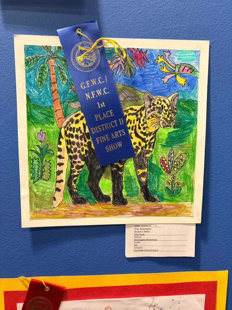 A colorful drawing of a leopard set in a vibrant jungle scene, decorated with trees and tropical plants, featuring a blue ribbon indicating 1st place in a fine arts show.