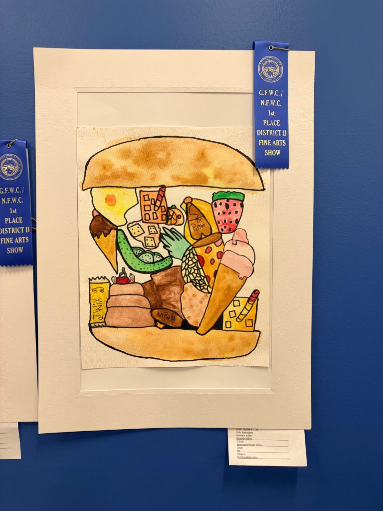 A colorful illustration of a large sandwich filled with various food items, including pizza, ice cream cones, candy, and fruit, displayed in a frame with blue ribbons indicating first place in an art competition.