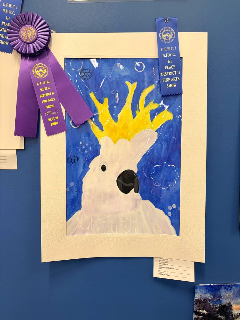 A colorful painting of a bird with a prominent yellow crown, displayed in a white frame. The background features varying shades of blue and abstract bubbles. Several award ribbons indicating first place in a fine arts show are attached nearby.