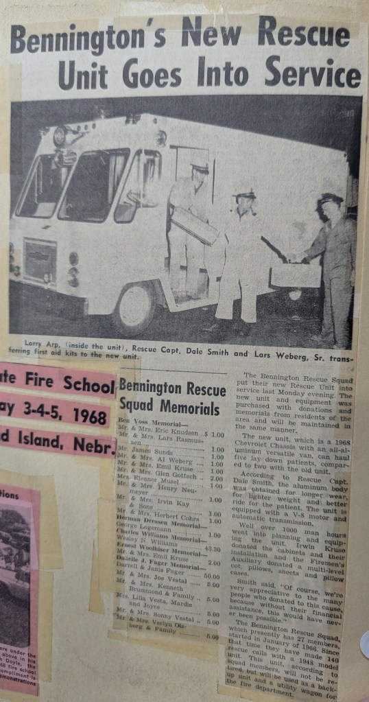 A newspaper clipping announcing the launch of Bennington's new rescue unit, featuring a photo of three men, including Larry Arp inside the vehicle, and Rescue Capt. Dale Smith and Lars Weberg, Sr. shown outside. The article discusses the unit's service and associated memorials.