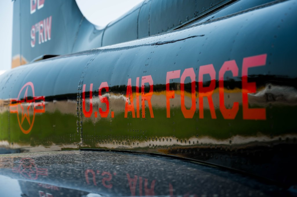 Close-up view of a U.S. Air Force aircraft fuselage with the words 'U.S. AIR FORCE' prominently displayed in red.